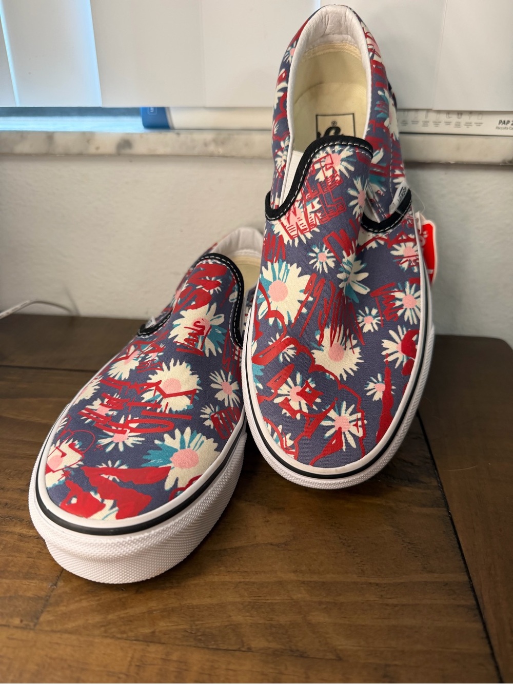 Vans Classic Slip-On sneakers feature a unique "Floral Graffiti" pattern M7 W8.5
